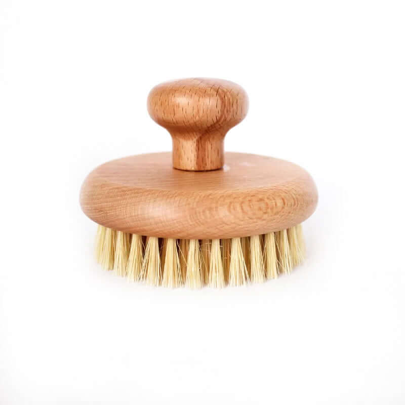 Organic sisal dry body brush with natural bristles and wooden handle for eco-friendly skincare.