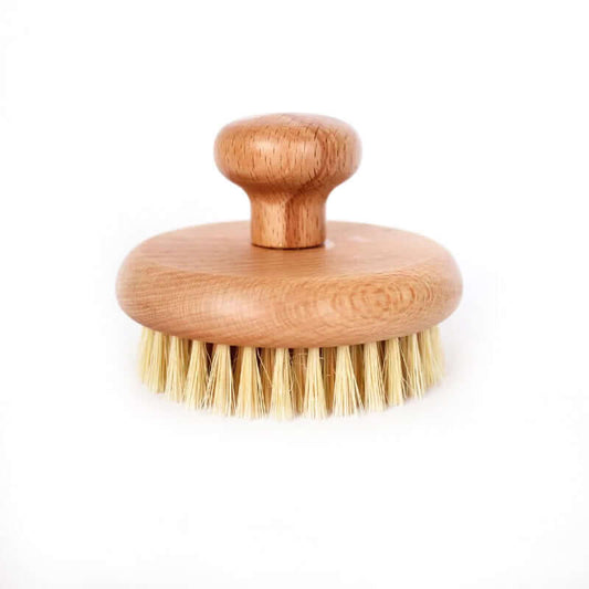 Organic sisal dry body brush with natural bristles and wooden handle for eco-friendly skincare.