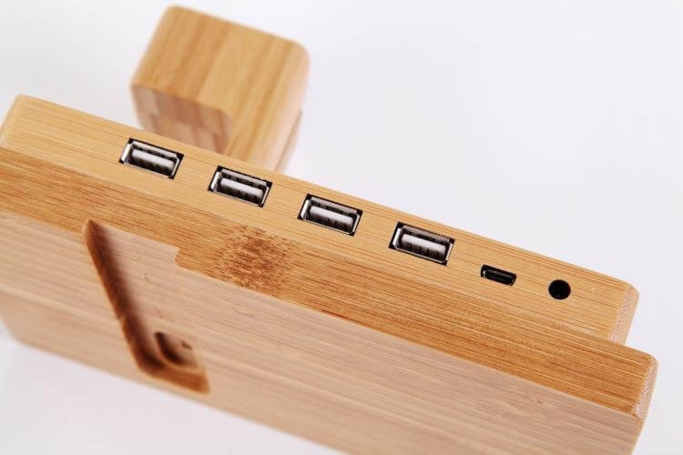 Bamboo docking station showcasing four USB ports and a sleek design for eco-friendly charging.