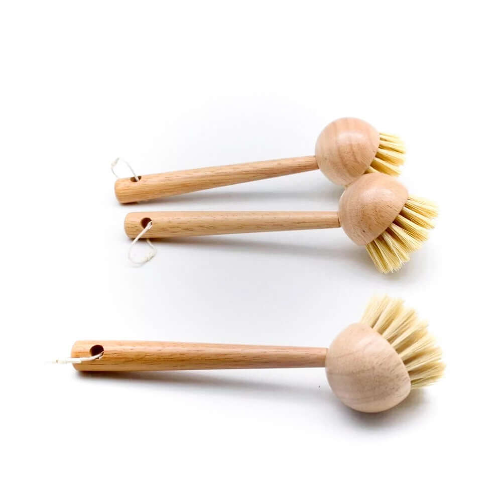 Set of eco-friendly bamboo sisal dish brushes, perfect for plastic-free kitchen cleaning.