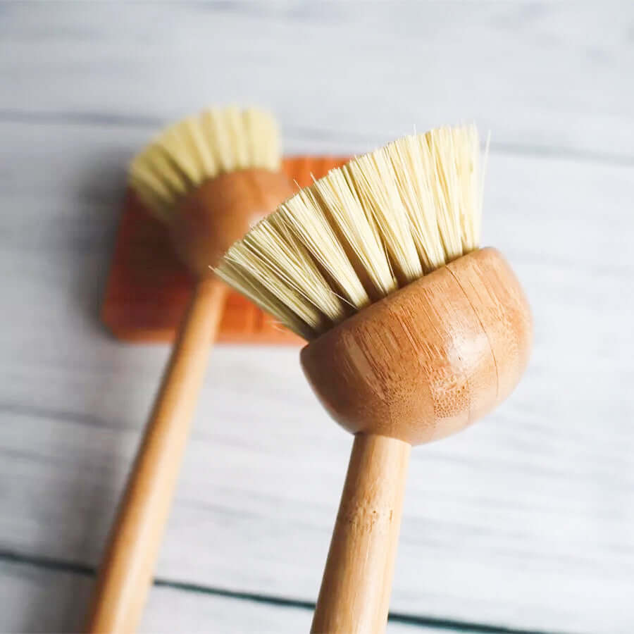 Eco bamboo sisal dish brush with natural bristles for plastic-free kitchen cleaning.