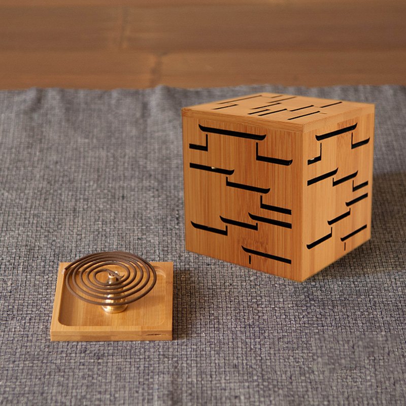 Bamboo Home Incense Burner with brass holder and decorative design on a textured surface, perfect for aromatherapy.