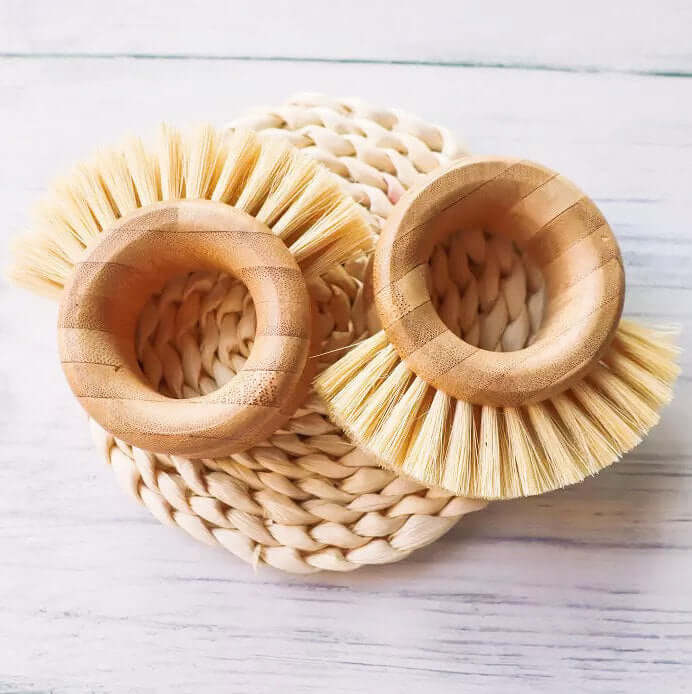 Bamboo sisal kitchen ring brushes on a natural woven placemat, perfect for sustainable veggie cleaning.