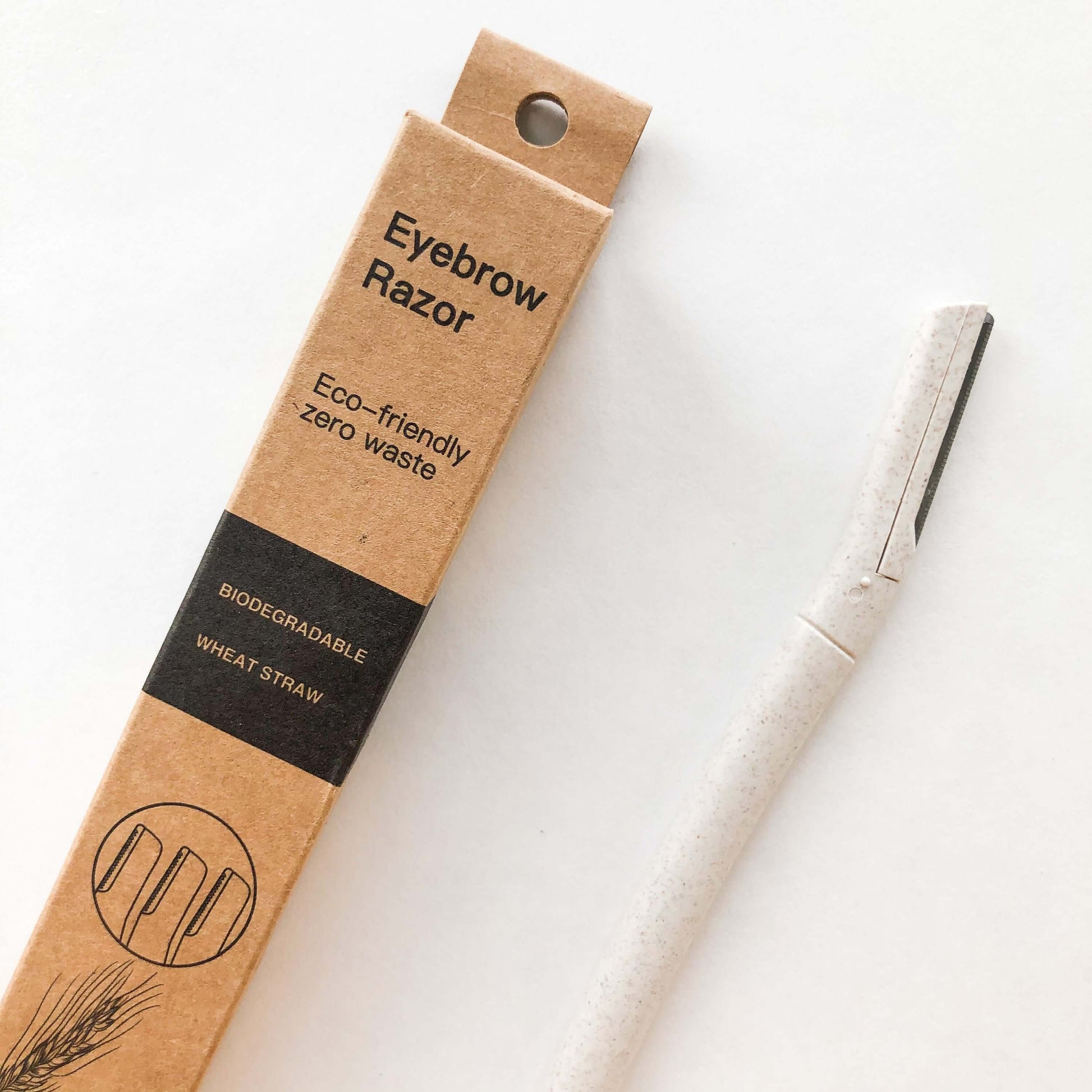 Biodegradable wheat straw eyebrow razor trimmer in eco-friendly packaging for gentler beauty routines.