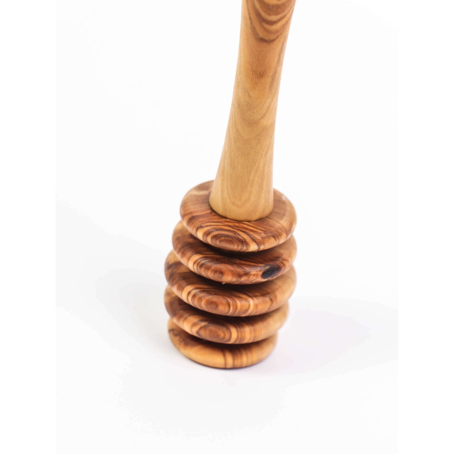 Handmade olive wood honey dipper with a stylish grooved end for easy honey drizzling and control.