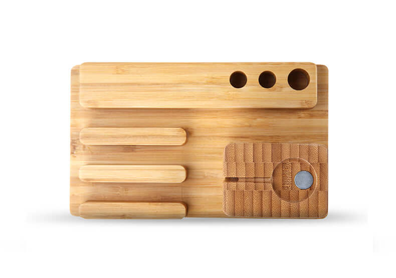 Handcrafted bamboo docking station with 4 USB ports for organized charging of Apple devices.
