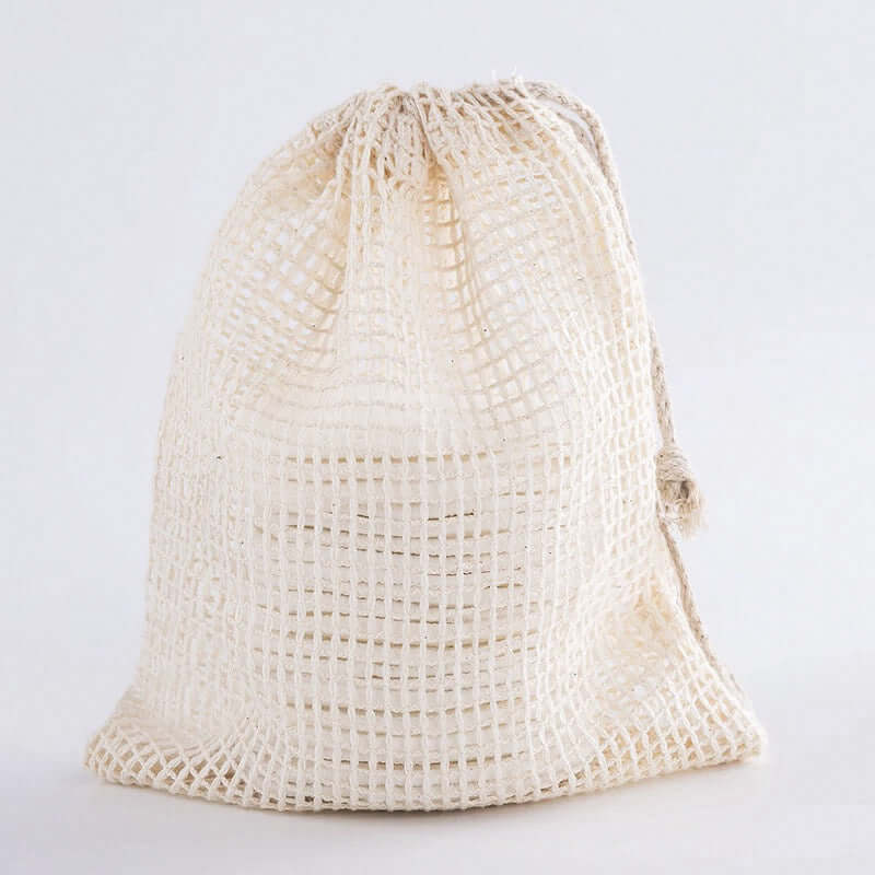 Eco-friendly mesh storage bag for reusable organic bamboo cotton facial pads.