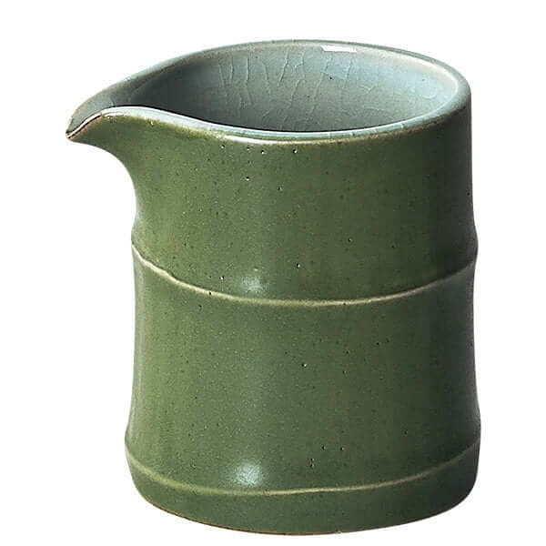 Green bamboo ceramic cup with a smooth finish, perfect for tea or as a decorative utensil.