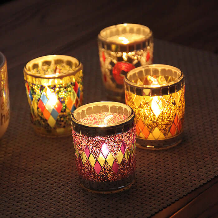 Handmade glass candle holders with colorful mosaic patterns, perfect for tealights or votive candles, adding elegance to any decor.