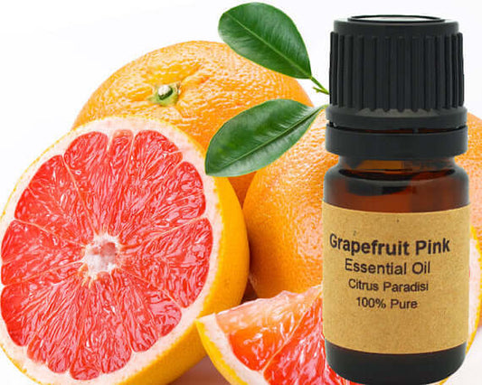 Grapefruit Essential Oil (Pink) 15 ml bottle with fresh pink grapefruit slices, showcasing its citrus aroma and purity.