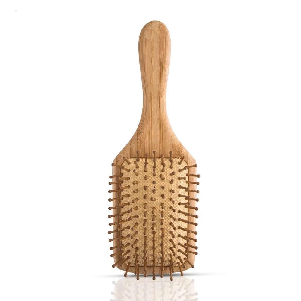 Natural bamboo hair brush for detangling, eco-friendly, zero waste, reduces static and frizz, suitable for all hair types.