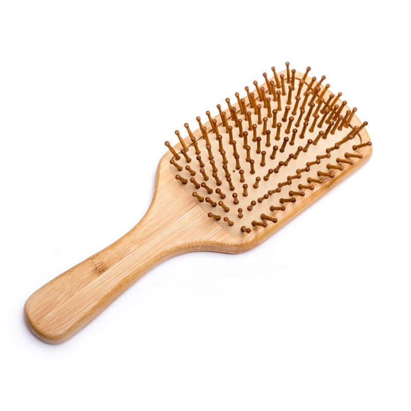Natural bamboo hair brush with large bristles for detangling and reducing static, eco-friendly and plastic-free.