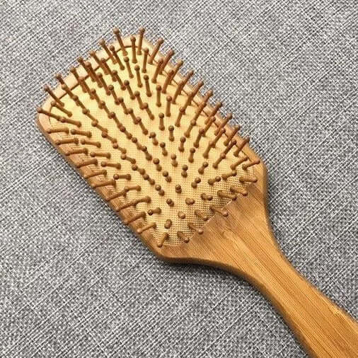 Natural bamboo hair brush with large bristles, eco-friendly and plastic-free, ideal for detangling and reducing static.