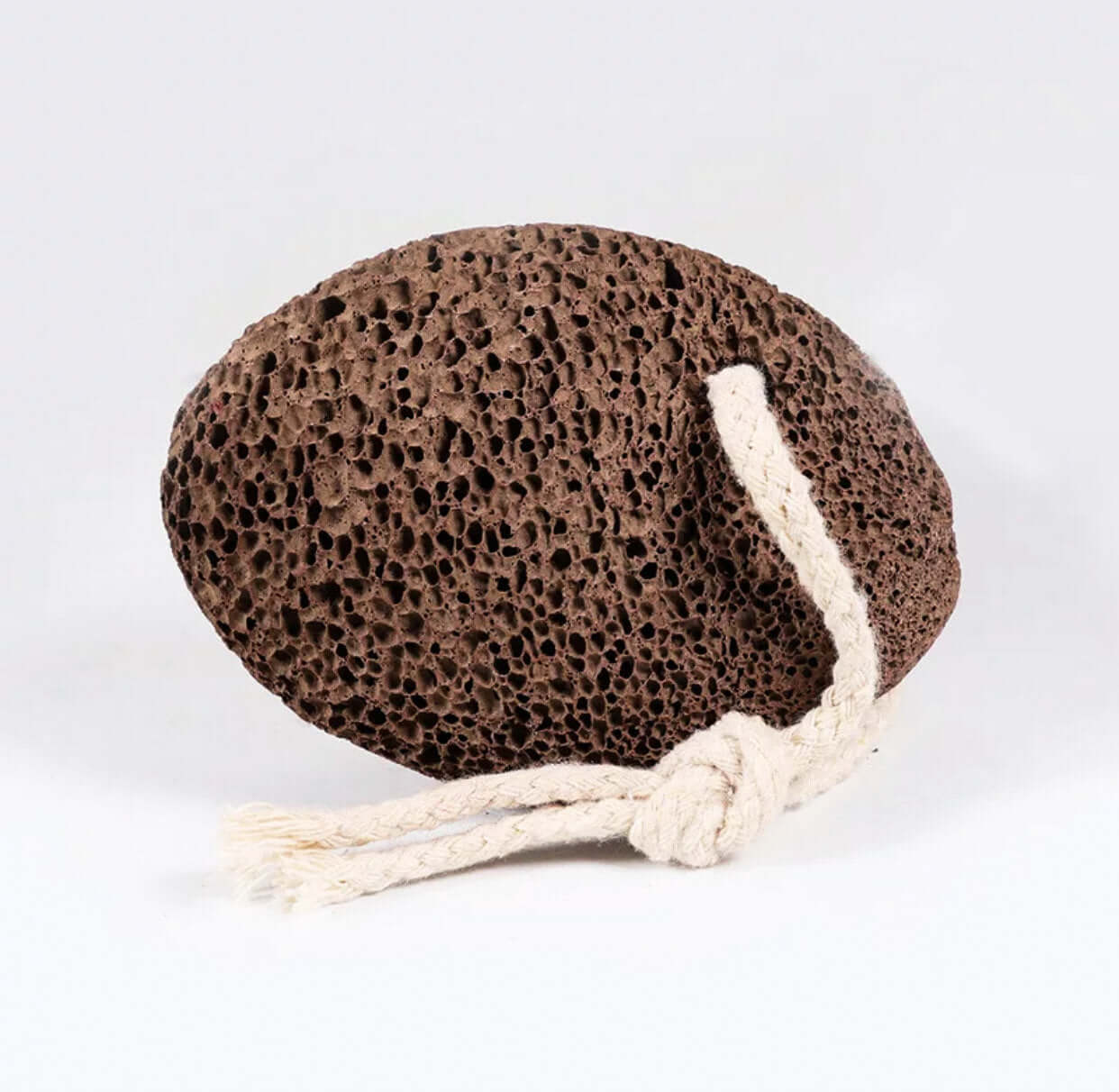 Natural lava stone pumice foot scrubber with rope, perfect for exfoliating calluses and maintaining foot health.