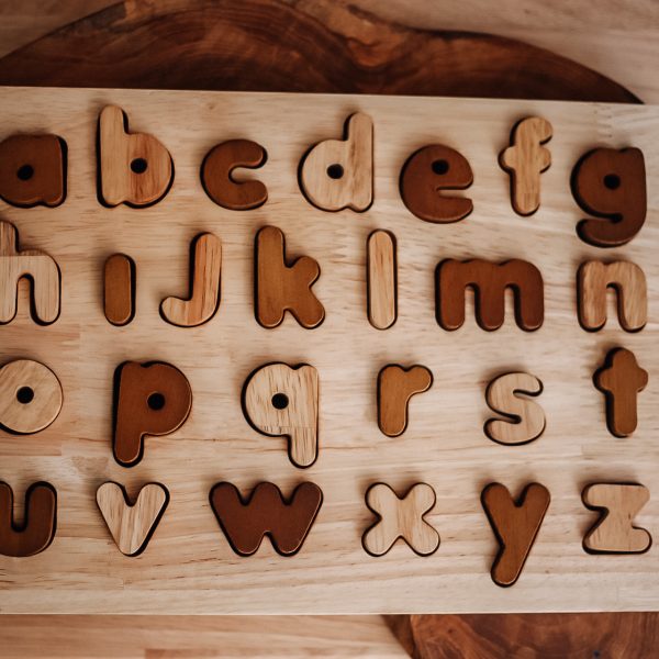 Natural lower case letter puzzle with wooden letters, ideal educational toy for early childhood learning.