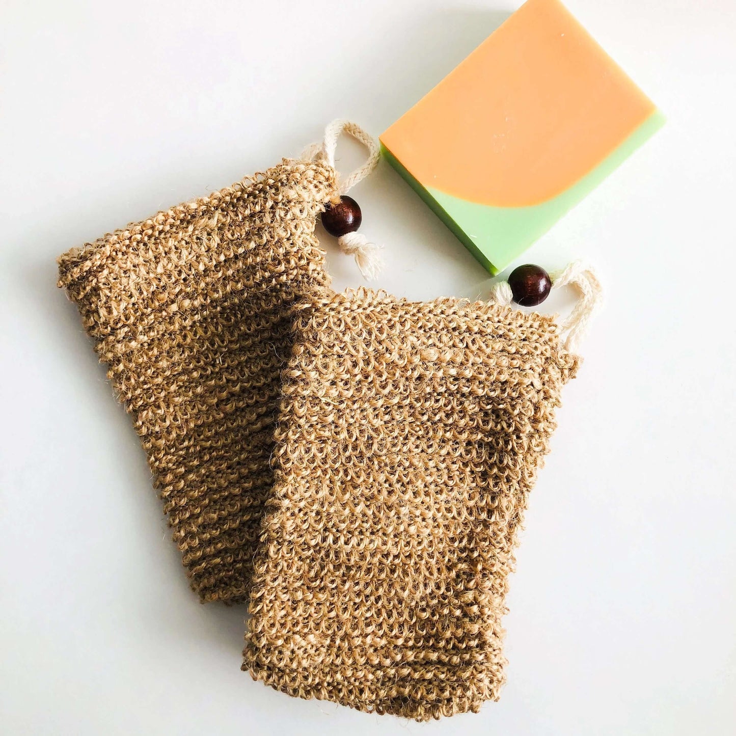 Natural jute soap bags with a bar of soap, perfect for zero waste and gentle skin peeling.