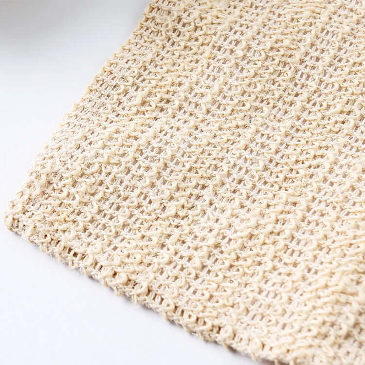 Natural sisal washcloth close-up showing organic texture for effective exfoliation.
