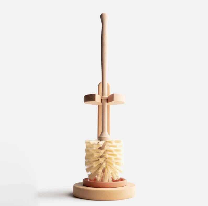 Eco-friendly plastic-free sisal bristle toilet brush with beechwood stand for sustainable cleaning.