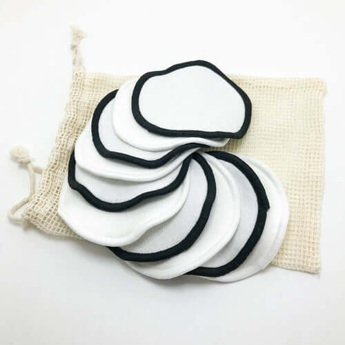 Reusable organic bamboo cotton facial pads in a pouch for eco-friendly skincare and zero waste lifestyle.