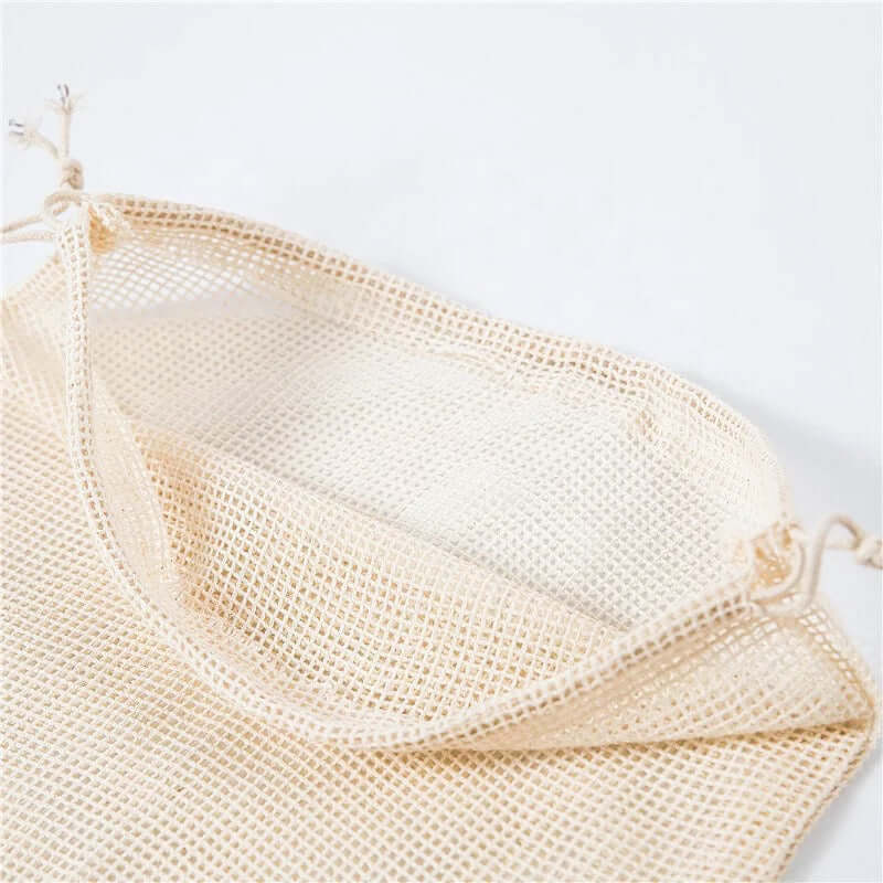 Reusable organic cotton mesh produce bag, eco-friendly, zero waste, perfect for shopping fruits and veggies without plastic.