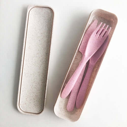 Reusable wheat straw cutlery set in a eco-friendly box with pink utensils, perfect for reducing plastic waste.