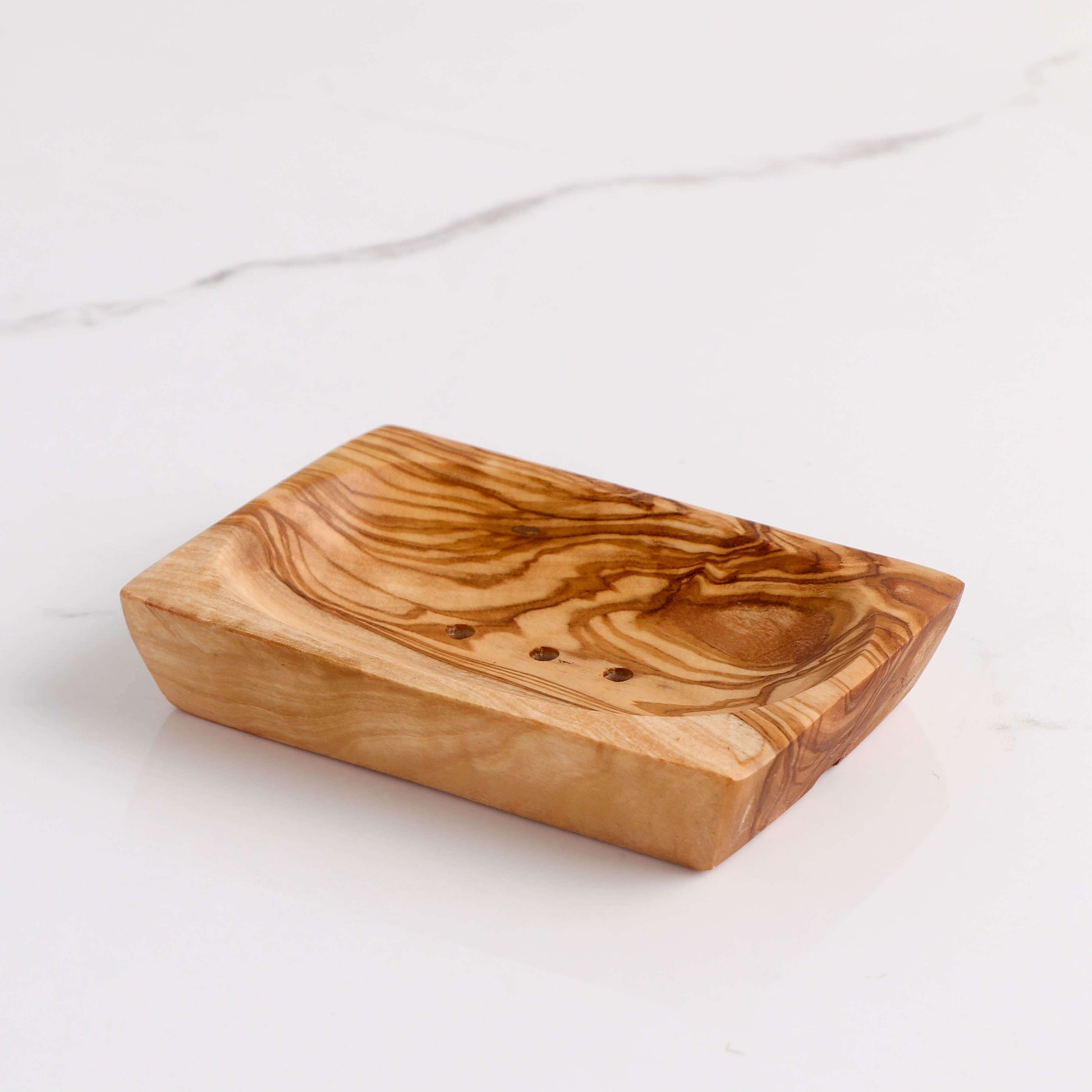 Handmade rectangular olive wood soap dish with smooth edges, designed for water drainage and eco-friendly use.