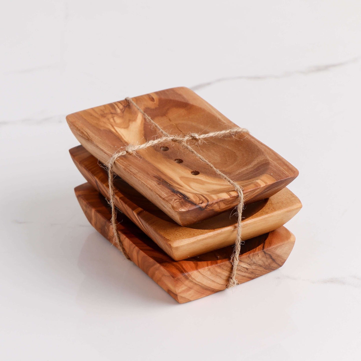 Set of 3 handmade olive wooden soap dishes, showcasing natural wood grain and drainage holes.