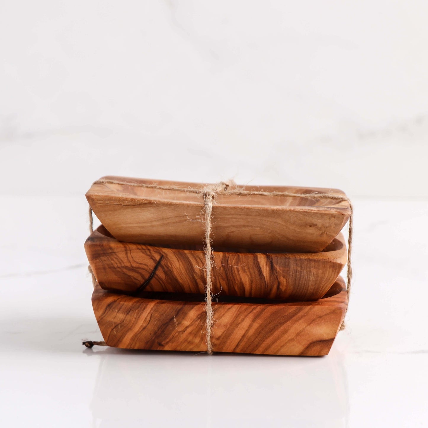Set of 3 handmade olive wooden soap dishes, elegantly designed to keep soap dry and extend its lifespan.