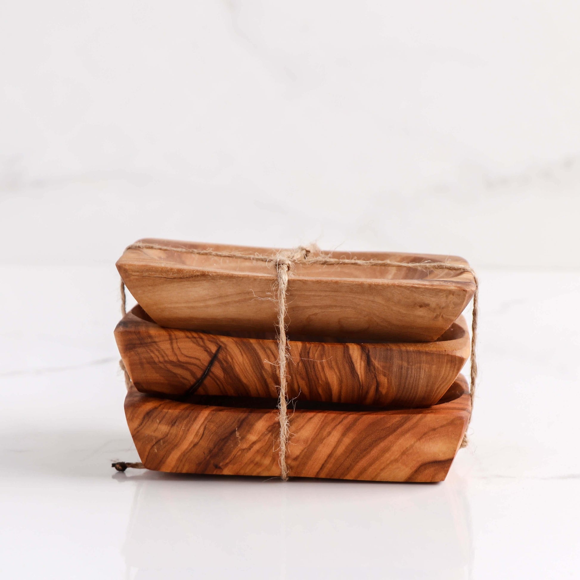 Set of 3 handmade olive wooden soap dishes, elegantly designed to keep soap dry and extend its lifespan.