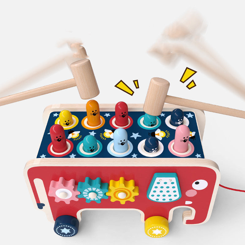 Colorful wooden pounding bench toy with cartoon animals and hammers for toddlers' fun and educational play.