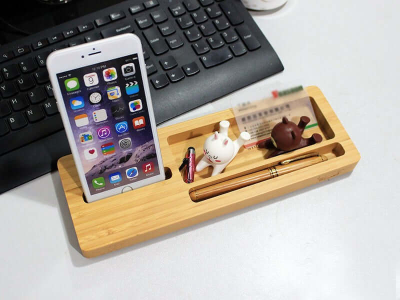 Bamboo desktop organizer with smartphone holder and cute desk accessories for stylish office storage.