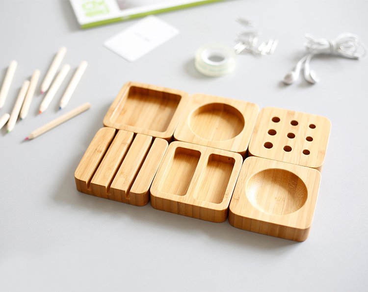 Bamboo desktop organizer set featuring six unique storage blocks for an eco-friendly workspace.