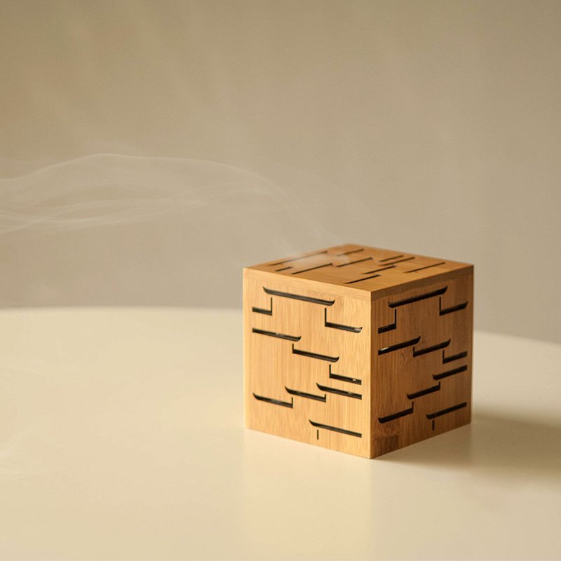 Elegant bamboo incense burner with smoke, showcasing hand-carved patterns for a serene aromatherapy experience.