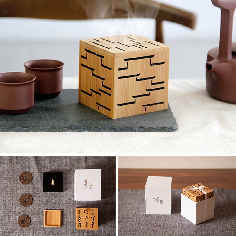 Bamboo Home Incense Burner showcasing intricate design with steam, paired with tea cups and accessory holders.