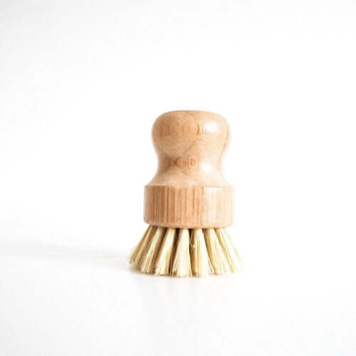 Bamboo pot scrubber with natural bristles, eco-friendly dish brush for tough stain removal.