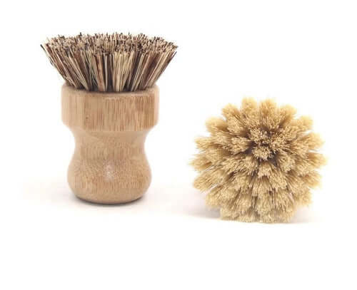 Bamboo pot scrubber brush with natural bristles, eco-friendly cleaning tool for tough stains, ergonomic design.