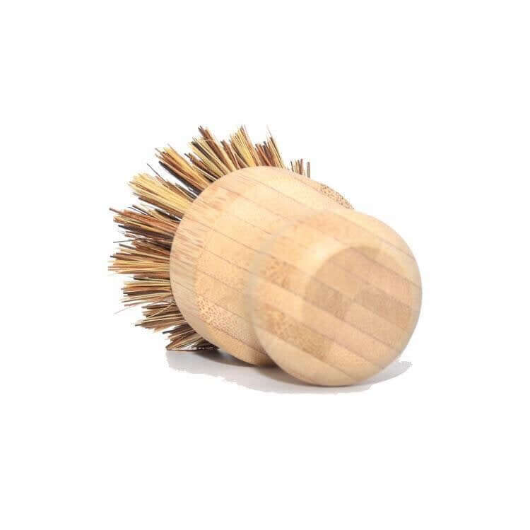 Bamboo pot scrubber with natural bristles, perfect for eco-friendly cleaning of pots and pans.