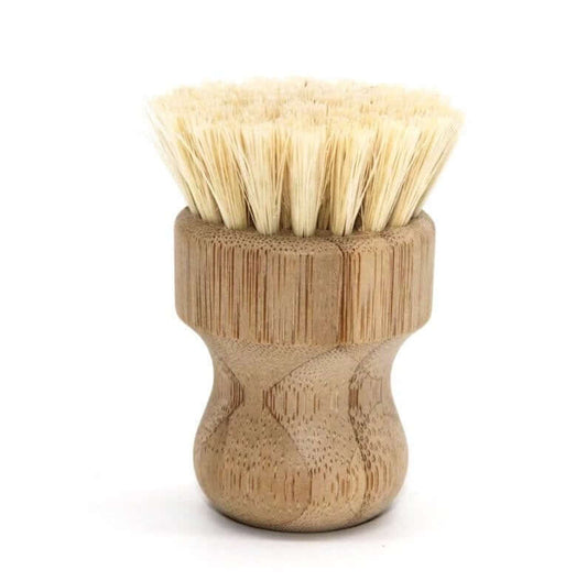 Natural fiber bamboo pot scrubber with ergonomic handle for eco-friendly cleaning.