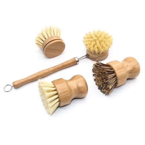 Set of bamboo dish brushes with natural bristles, eco-friendly and zero waste kitchen cleaning tools.