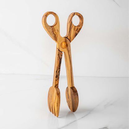 Handmade olive wood salad tongs with a unique design, offering elegance and eco-friendly serving solutions.