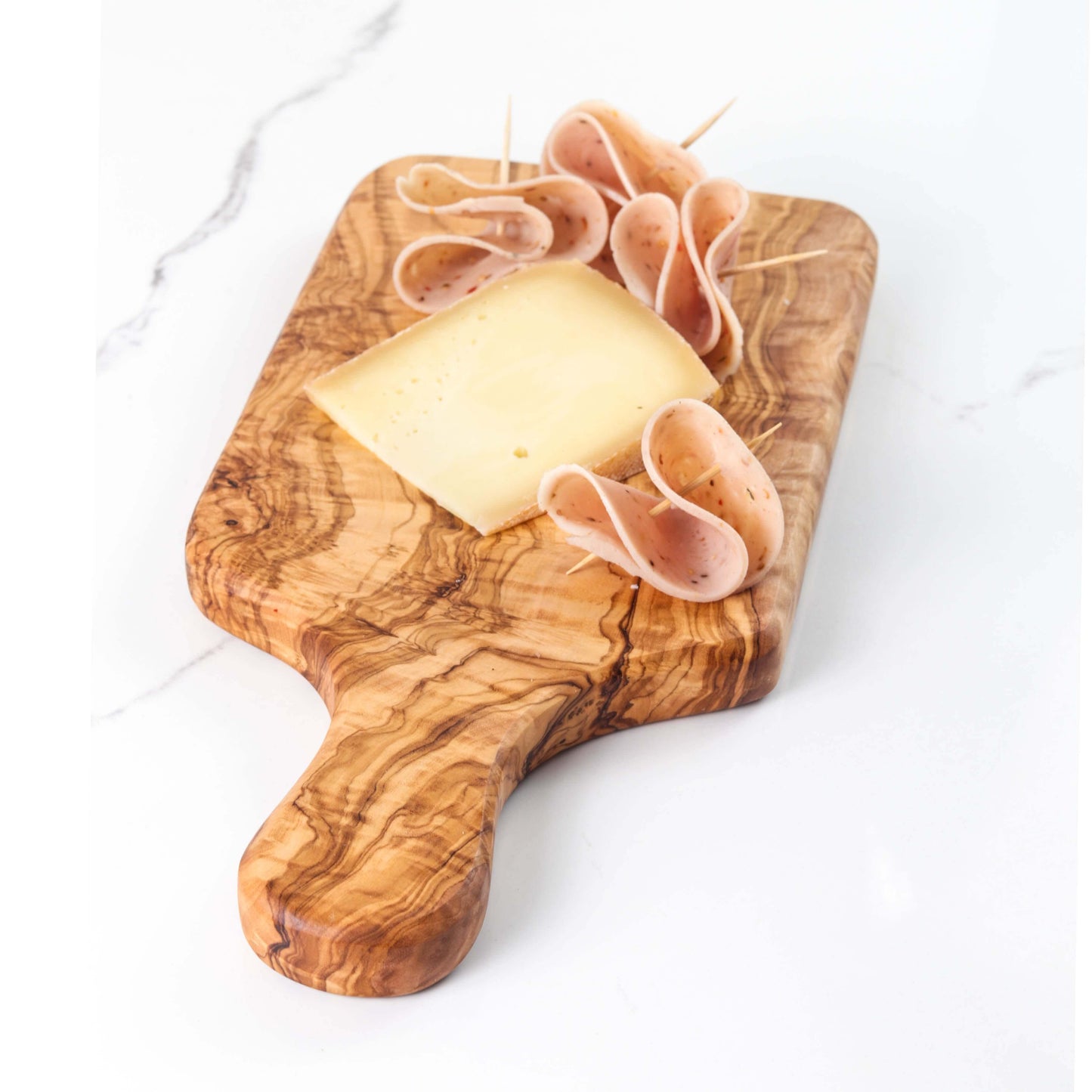 Handmade olive wood cutting board with cheese and sliced meat, perfect for meal prep and serving.