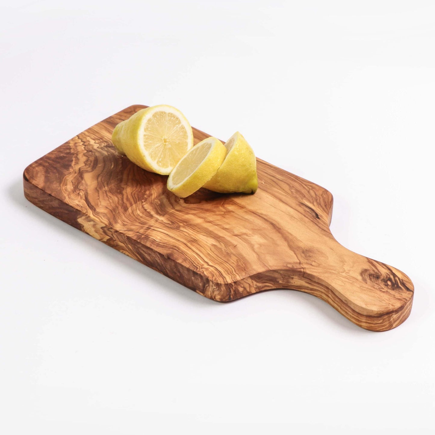 Handmade olive wood cutting board with lemon slices, perfect for meal prep and resistant to bacteria.