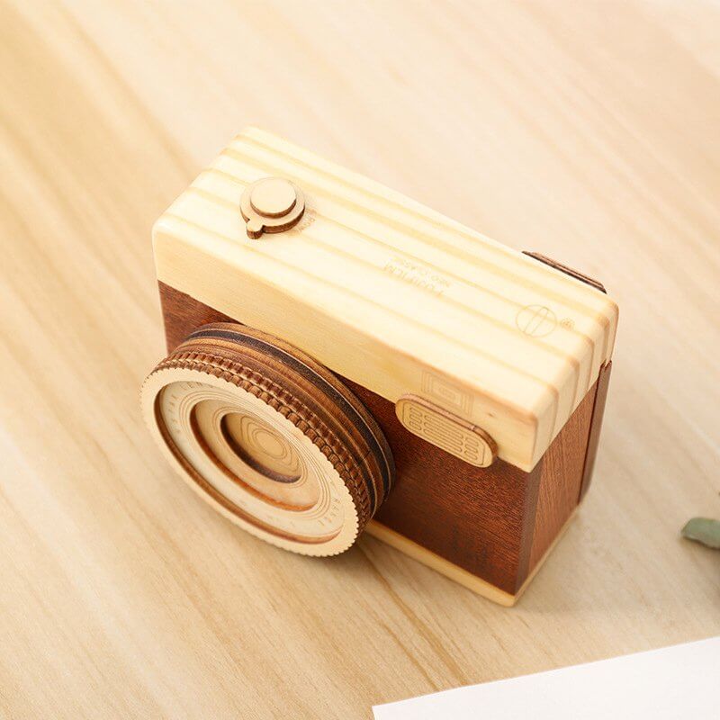 Wood Camera Music Box featuring a charming design, crafted from genuine wood, playing 'City in the Sky' melody.