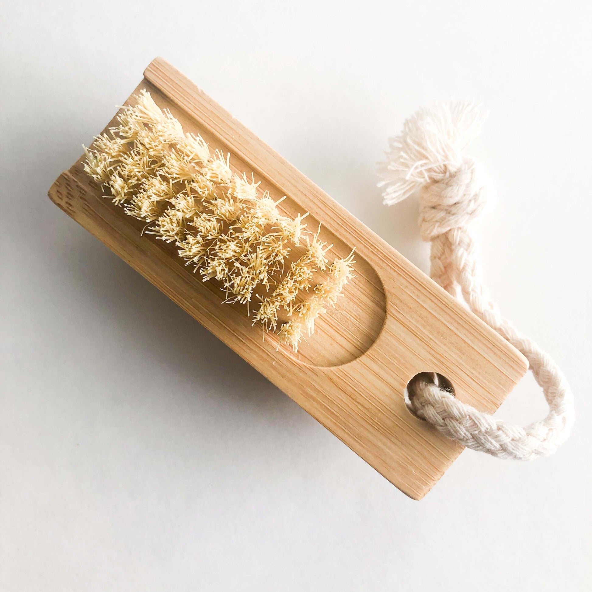 Double sided bamboo nail brush with sisal bristles, zero waste and plastic free for clean fingernails.