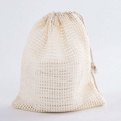 Eco-friendly mesh storage bag for reusable organic bamboo cotton facial pads.