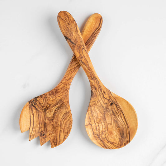 Handmade olive wood salad serving set including fork and spoon, showcasing unique grain patterns and durable design.