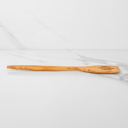 Handmade olive wood slotted spatula, lightweight design, perfect for flipping and stirring in the kitchen.