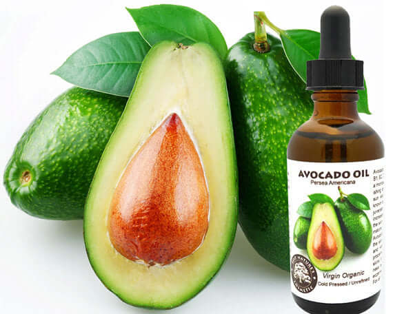 Organic virgin avocado oil bottle next to sliced avocado, highlighting its nourishing properties for skin care.