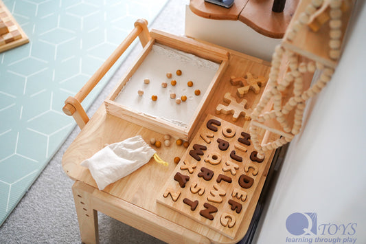 Natural Capital Letter Puzzle on a wooden table, promoting letter recognition and cognitive development in children.