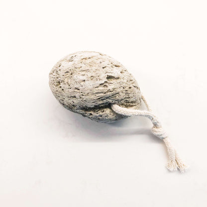 Natural lava stone pumice foot scrubber with rope for easy handling and exfoliating calluses.